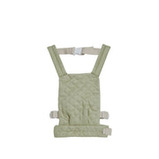 A qulited sage Olli Ella Doll Carrier with padded straps designed for carrying dolls.